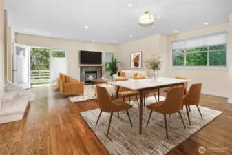 Main level has French doors to deck and gas fireplace. Virtually staged