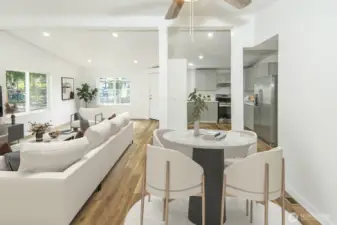 Dining room with a peak at kitchen *Virtually staged*