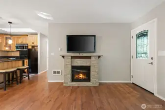 Living toward kitchen and hallway to bedrooms/bath.