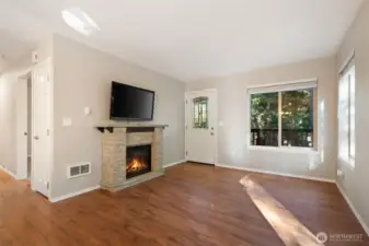 Living room toward entry door.  Hallway on left w/door to large bedroom.