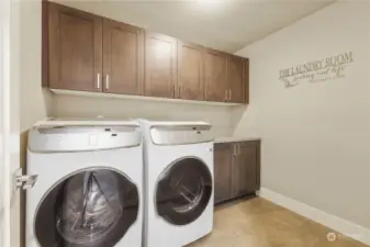 Laundry is no chore with all the space & handy folding counter. The front load washer & dryer are also included