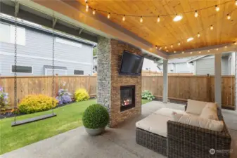 Dine alfresco, enjoy your favorite beverage while watching the fire or swing away the days stresses in this gorgeous outdoor living area