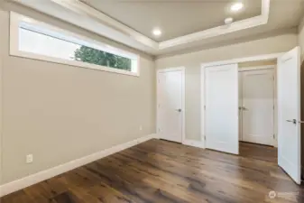 Secondary view of the main level den with double doors and closet. The guest coat closet outside the doors is huge and adds to the already great storage