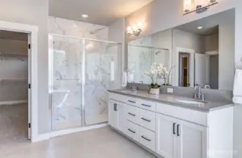 Double vanity, tiled shower.. and the CLOSET..