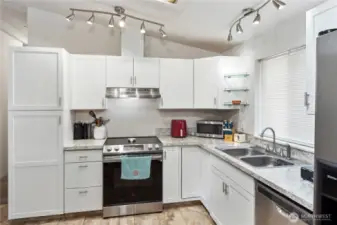 Skylight and window bring in a lot of natural light! Electric stove/oven is new