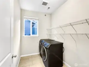 Utility room on the main floor with lots of storage space