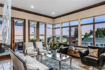 Living room boasting giant windows that allow views from Seattle to Mt Rainier