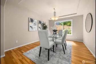 Spacious dining room off the living is easily accessed from the kitchen (at right) and overlooks the back yard--which gets great evening light.