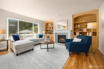 Built-in cabinetry flanking the second gas fireplace give the family room a cozy, custom feel.