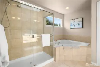 Spacious primary bath includes a soaking tub, walk in shower, water closet, and dual-sink vanity.