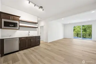 Lower level with wet bar, living room, bedroom, and 3/4 bath.