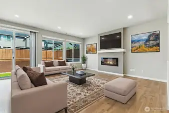 Open concept floor plan is perfect for today's lifestyle. The wall of windows brings the outside in. This room is virtually staged