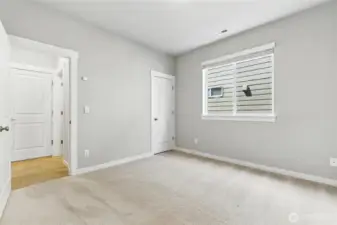Main floor bedroom can be used as an office or separate living space with nearby bathroom and easy exterior access.