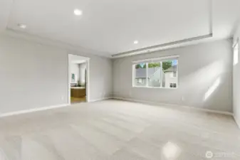 Primary bedroom with full en suite bathroom and walk in closet.