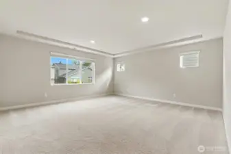 Upper level primary bedroom is spacious for your bed, furniture and offers room for a desk or sitting area.