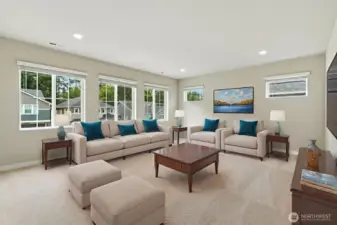 Upper level bonus room is an ideal hosting and gathering space. This room is virtually staged.