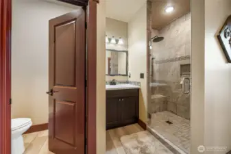 large, tiled shower & private commode.