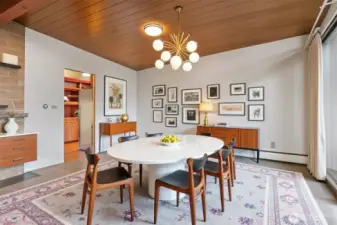 Virtually staged dining room, adjacent to the kitchen and with a sliding door to the front deck.