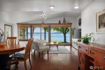 Spacious Living room with vaulted ceiling and massive wall of windows to amazing views.