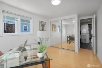 3rd bedroom with laminate wood flooring.