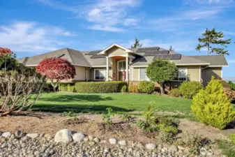 Beautiful landscaping adds the finishing touch to this lovely home.