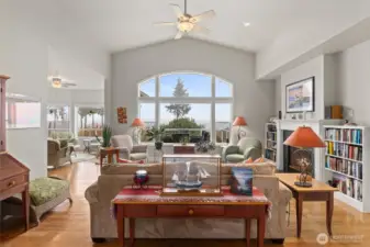 Formal living room with propane fireplace and views out to Mount Baker, Puget Sound, Utsalady Bay and the Cascades.