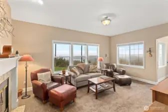 Main floor family room.  Fireplace is 2-sided and opens to both the family room and the living room.