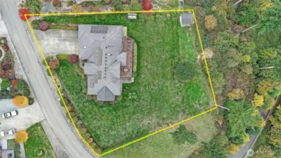 Approximate lot lines. Community property (not buildable lots) to the North and East of the parcel.