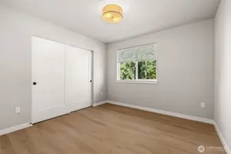 One of the 2 primary bedrooms with extra large closet space and private bath.