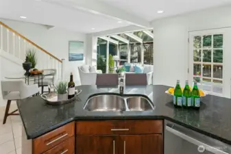 Kitchen opens to solarium's bonus space.