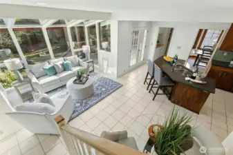 What a wonderful flow to this floor plan! Walls of glass and French doors opening to deck perfectly connect this indoor comfort with the beauty of nature outside.