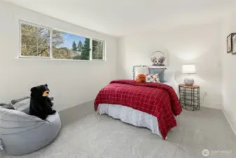 Additional upper level bedroom at back of home.