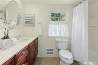 Solar tube adds natural light to this bathroom.