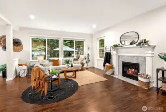 Spacious living room with gas fireplace and big windows