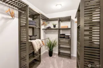 Large walk-in closet with custom built-in storage