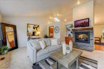 Living room with gas fireplace and vaulted ceilings