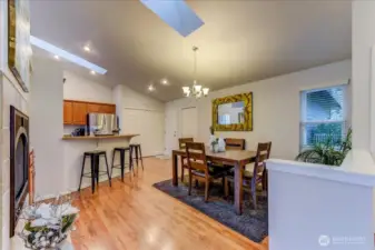 Eating bar to kitchen open to dining room.