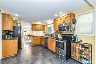 Solid "Old School" Oak Kitchen Cabinets Still Shiny & New Complimented by the Stainless & Black Kitchen Appliance Package~