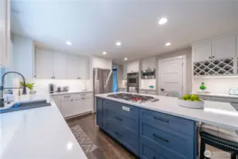 Dream kitchen!  Large island with Wolf gas stove, double oven, walk-in pantry, breakfast bar, counter depth fridge and more!