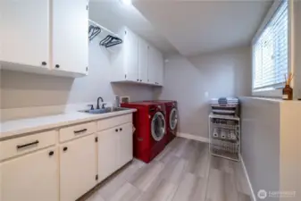 Updated main floor utility room off of the garage.  Washer and Dryer are included.