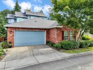 Beautiful brick accents, landscaping for maximum privacy and plenty of room for two cars in the driveway