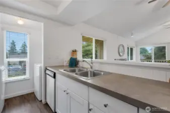 The full size Washer and Dryer are located at the back of the kitchen.