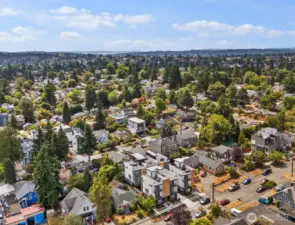 This southwesterly view captures the home in the foreground, with Ballard’s vibrant streets and the sparkling waters of Shilshole Bay stretching out in the distance. It’s a setting that blends neighborhood charm with a glimpse of Puget Sound beauty.
