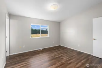 Another view of the primary bedroom