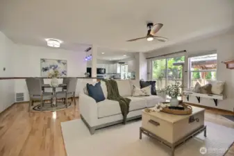 Dining area flows seamlessly into the kitchen and features a breakfast bar.