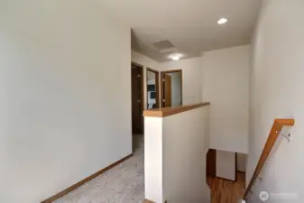Light filled landing. The 2 additional bedroom can be seen on the left.