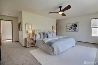 Huge Primary Suite with ceiling fan.