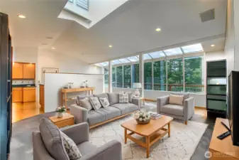 A comfortable area to relax, watch a show or entertain off the kitchen and warmed by a toasty fireplace