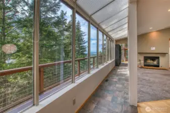 The window wall goes the distance on the west wall on the main floor offering bright, natural light and calmness