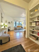 The spacious elegant entry boasts a full wall of built-ins!